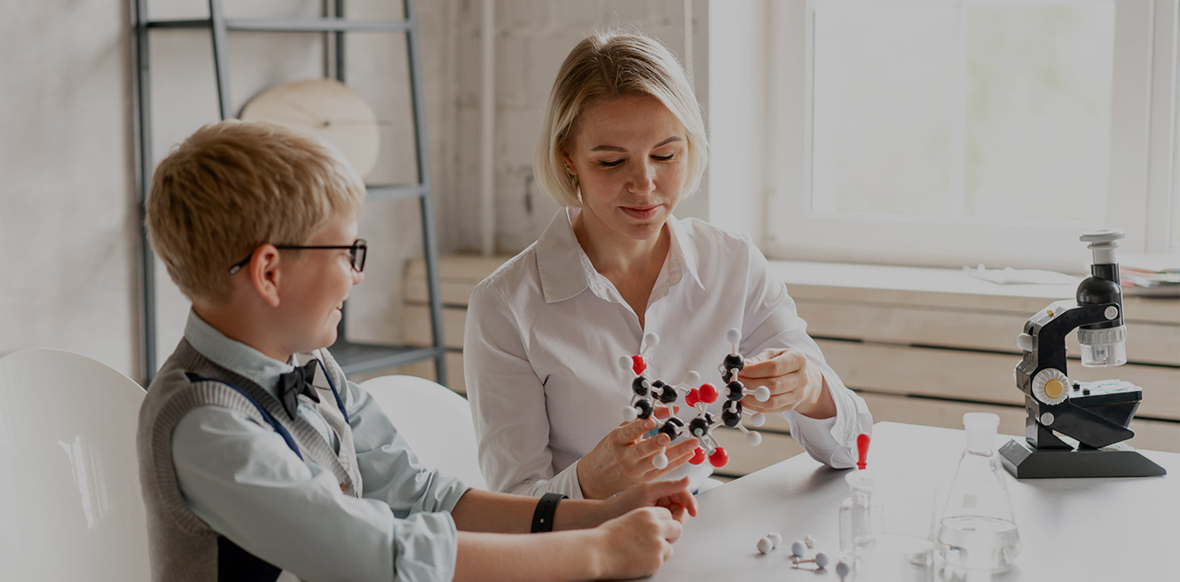 Female science tutor in Marietta studying chemistry with student